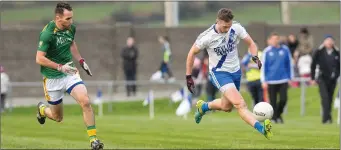  ??  ?? Paulie O’Donoghue of St Marys in full flight under the close eye of Seamus O’Sullivan of Skellig Rangers during the South Kerry SFC Final