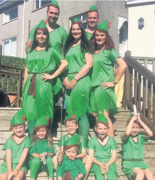  ??  ?? Getting ready for the Peter Pan record attempt are, top row, Jonathan Thomas and Chris Tossell, middle row, Angharad Howells, Victoria Tossell, Nikki Curtis and, front row, Saffron Russell, Gwen Thomas, Carter Ronan, Rowan Tossell, Harrison Tossell and...