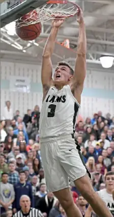  ?? Matt Freed/Post-Gazette photos ?? Pine-Richland’s Dan Petcash dunks against Butler Jan. The Rams should get the top seed in Class 6A. 8.