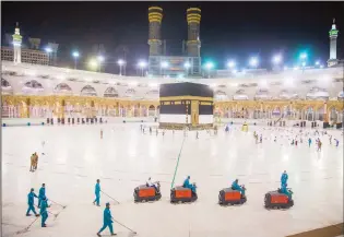  ??  ?? In this file photo, the area around the Holy Ka’aba is prepared for pilgrims, in Makkah, Saudi Arabia. (Saudi
Ministry of Media via AP)