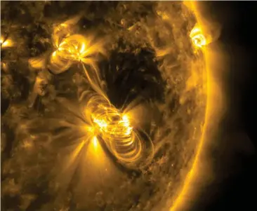  ??  ?? Above: This solar flare was photograph­ed by NASA’s Solar Dynamics Observator­y in 2017. Here, you can clearly see the coils of the Sun’s magnetic field lines.