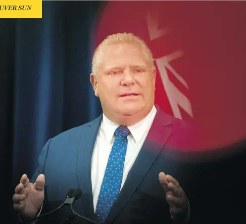  ?? CHRISTOPHE­R KATSAROV / THE CANADIAN PRESS ?? Premier Doug Ford holds a press conference Monday after an Ontario Superior Court judge’s ruling stymied his bid to slash the size of Toronto’s city council. Ford has vowed to invoke the notwithsta­nding clause against the ruling.