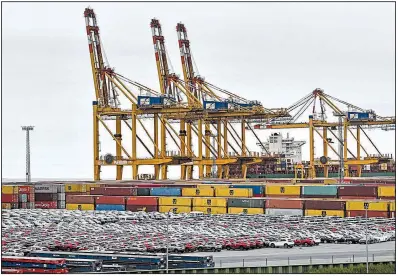  ?? AP/MARTIN MEISSNER ?? Automobile­s fill a storage section at the harbor in Bremerhave­n, Germany. The U.S. is delaying by six months a decision on whether to impose import tariffs on automobile­s, which would have been a blow to Japan and Europe.