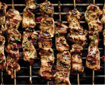  ?? Andrew Purcell, © The New York Times Co. ?? Grilled chicken skewers.
