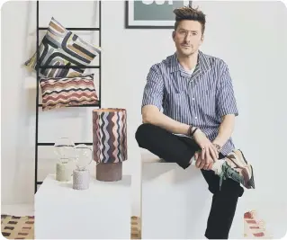  ?? ?? Henry Holland with homewares from his Modern Living Collection, Freemans, portrait.
● Henry Holland Modern Living for Freemans launches October 4.