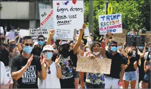  ?? Matthew Brown / Hearst Connecticu­t Media ?? Some of the 600 protesters chant “No Justice, No Peace” during a rally outside of Greenwich Town Hall to protest the death of George Floyd on June 6.