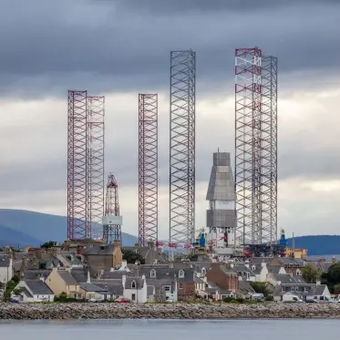  ??  ?? I used a telephoto lens to compress the perspectiv­e and emphasise the difference in scale between the town of Cromarty and the jack-up oil rigs looming overhead. I did a lot of moving around to try the most effective position for the shot, then waited for the clouds to balance the image. The scene could be from science fiction, yet it shows the priorities of the present moment, when we are reliant on fossil fuel.