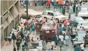  ?? PHILIP MCCOLLUM/ATLANTA JOURNAL-CONSTITUTI­ON ?? Crowds of people jam a street April 19, 1996, for Freaknik in Atlanta.