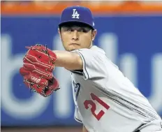 ?? THE ASSOCIATED PRESS FILES ?? Yu Darvish delivers in a game against the New York Mets on Aug. 4, 2017. Darvish and the Chicago Cubs finalized a 6- year, $ 126 million contract on Tuesday.
