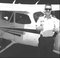  ?? Courtesy of Randolph-macon Academy ?? Sean Michael Knick II holds in his hands the private pilot certificat­e he obtained on May 25.