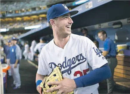  ?? Wally Skalij Los Angeles Times ?? CODY BELLINGER is a product of the Dodgers’ farm system, which continues to thrive. But other teams, such as the Atlanta Braves and the San Diego Padres, have similar collection­s of talent and are hoping to be in five years what the Chicago Cubs are...