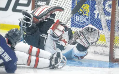  ?? JASON MALLOY/THE GUARDIAN ?? Team Canada goalie Dominic Larocque just missed this shot from Korea’s Seung Hwan Jung during a second period power play Monday at MacLauchla­n Arena during Day 2 action at the World Sledge Hockey Challenge.