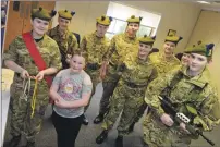  ??  ?? Potential recruit Ty-Leigh Kitson was shown the advantages of joining the Army Cadets by Jodie Standen at the open evening.