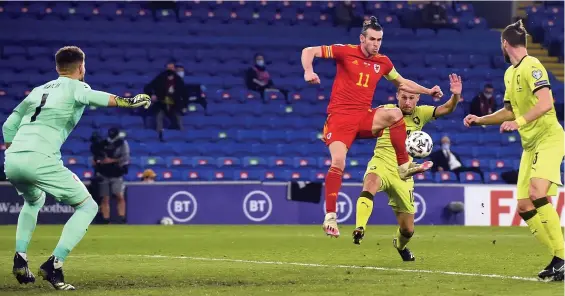 ??  ?? Gareth Bale volleys the ball goalwards in the first half, only to be denied by a fine save from Czech goalkeeper Tomas Vaclik.