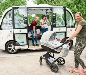  ?? — AFP ?? People using a self-driving bus being tested out on a tourist route in Tallin, estonia.