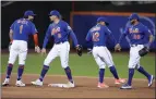  ?? FRANK FRANKLIN II — THE ASSOCIATED PRESS ?? From left, the Mets' Jeff McNeil, Brandon Nimmo, Francisco Lindor and Tommy Pham celebrate Tuesday's 2-0 win over the Phillies.