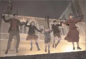  ?? The Associated Press ?? This image released by Disney shows, from left, Lin-Manuel Miranda, Pixie Davies, Joel Dawson, Nathanael Saleh and Emily Blunt in “Mary Poppins Returns.”