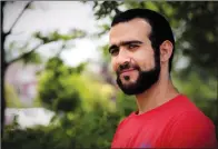  ?? CP PHOTO COLIN PERKEL ?? Former Guantanamo Bay prisoner Omar Khadr, 30, is seen in Mississaug­a on Thursday. Khadr cannot avoid a huge civil judgment against him by recanting the confession and guilty plea he made before an American military commission, lawyers acting for the...