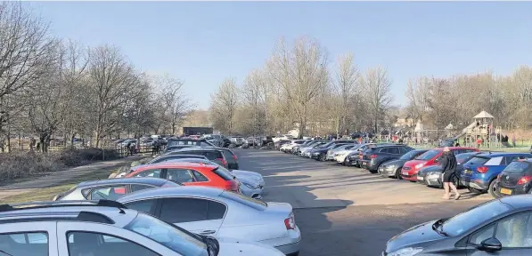  ?? Pictures by Leanne Bagnall ?? PARK LIFE: A packed car park at Westport Lake in Tunstall yesterday on the first sunny weekend of the year.