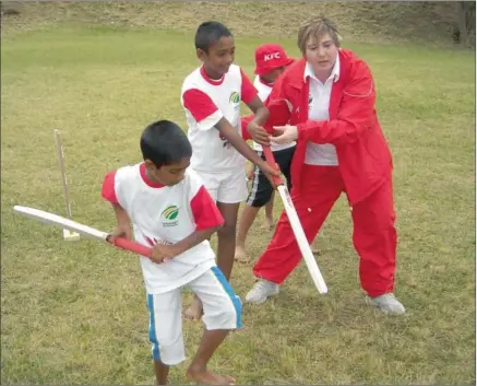  ??  ?? Mini cricket coach Romy Naidoo puts some of her school’s budding cricketers through their paces.
