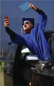  ?? RECORDER PHOTO BY NAYIRAH DOSU ?? Strathmore High School’s Omar Lopez shares his graduation with social media, Thursday, May 28, 2020, at Spartan Stadium.