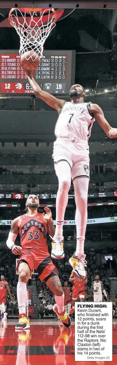  ?? Getty Images (2) ?? FLYING HIGH: Kevin Durant, who finished with 12 points, soars in for a dunk during the first half of the Nets’ 112-98 win over the Raptors. Nic Claxton (left) slams in two of his 14 points.