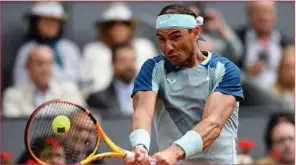  ?? (AFP) ?? Rafael Nadal returns the ball to Serbia’s Miomir Kecmanovic during their 2022 ATP Tour Madrid Open tennis tournament singles match at the Caja Magica in Madrid on Wednesday.