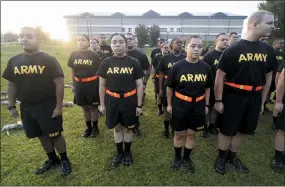  ?? SEAN RAYFORD — THE ASSOCIATED PRESS FILE ?? Students in the new Army prep course stand at attention after physical training exercises at Fort Jackson in Columbia, S.C., in August.