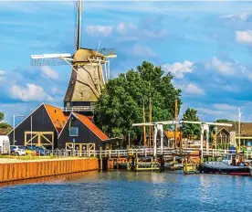  ??  ?? RELAXED ATMOSPHERE: Harderwijk’s pretty harbour and windmill