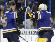  ?? JEFF ROBERSON — THE ASSOCIATED PRESS ?? St. Louis Blues goalie Jake Allen, right, celebrates with Colton Parayko after the Blues’ 3-1 victory over the Minnesota Wild in Game 3 of an NHL hockey first-round playoff series Sunday in St. Louis. The Blues won 3-1.