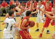  ?? MICHAEL REEVES — FOR DIGITAL FIRST MEDIA ?? Haverford’s Luke Verzella is trapped by the swarming Unionville defense Friday night. The Indians forced 27 turnovers and never trailed in the 19-point win.
