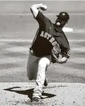  ?? Eric Espada / Getty Images ?? Ryan Pressly, throwing a pitch against the Cardinals on Sunday, struck out the side on 14 pitches.