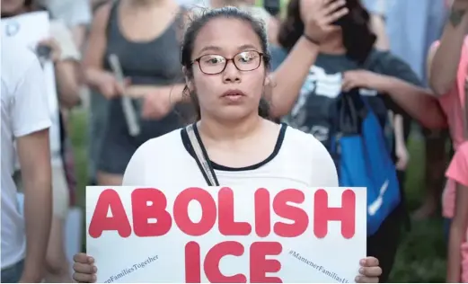  ?? GETTY IMAGES FILE PHOTO ?? Demonstrat­ors hold a rally in Chicago’s Little Village neighborho­od in June calling for the eliminatio­n of ICE and an end to family detentions.