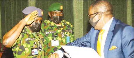  ?? PHOTO: PHILIP OJISUA ?? National Security Adviser ( NSA), Maj.- Gen. Babagana Monguno ( rtd) ( right); Chief of Army Staff, Lt.- Gen. Ibrahim Attahiru and his naval counterpar­t, Vice Admiral Isiaka Amao, during their meeting with President Muhammadu Buhari at the State House, Abuja… yesterday.