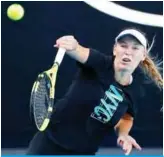  ??  ?? MELBOURNE: Denmark’s Caroline Wozniacki hits a shot during a practice session ahead of the Australian Open tennis tournament in Melbourne yesterday. — AFP