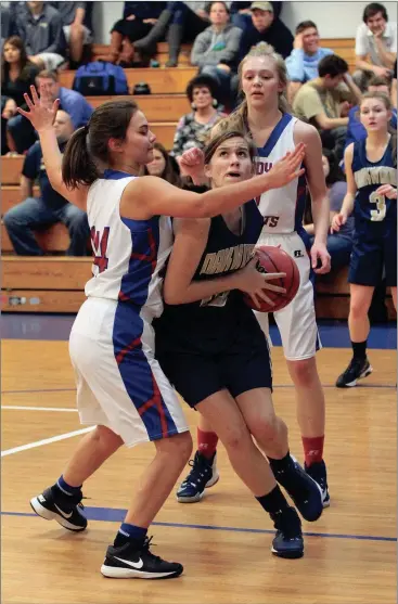  ??  ?? Oakwood Christian’s Annika Green drives the baseline during last Thursday’s home game against the Chattanoog­a Patriots. Green had 11 points and grabbed 16 rebounds as the Lady Eagles held on for a 45-40 victory. (Messenger photo/Scott Herpst) Oakwood...