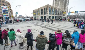  ??  ?? Protesters also held a round dance at the corner of Victoria Avenue and Albert Street that momentaril­y blocked traffic at the intersecti­on and drew mixed reactions from commuters.