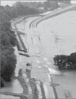  ?? Arkansas Democrat-Gazette/BENJAMIN KRAIN ?? Water from the Black River pours through several levee breaks in east Pocahontas in this photo taken May 4.