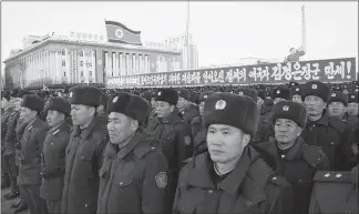  ?? JON CHOL JIN / AP ?? Military personnel gather Dec. 1 at Kim Il Sung Square in Pyongyang, North Korea. Tens of thousands of North Koreans attended the rally in a show of support for the country’s latest missile test. The signage behind them reads “Long Live General Kim Jong Un who brought about great victory in the historic and great cause of completing the state nuclear force and cause of building a rocket power.”