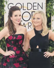  ??  ?? Tina Fey (L) and Amy Poehler (R) arrive for the 71st Golden Globe Awards held in Beverly Hills, the U.S., Jan. 12, 2014.