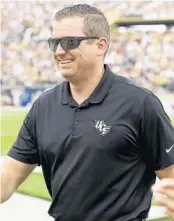  ?? STEPHEN M. DOWELL/ORLANDO SENTINEL ?? UCF athletics director Danny White asked fans to wear masks and told them he remains optimistic the Knights will play sports in 2020-21 despite the challenges presented by the coronaviru­s pandemic.