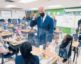  ?? EVAN VUCCI/AP ?? President Joe Biden has achieved his 100-day goal of having most elementary and middle schools open.