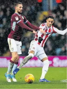  ??  ?? CLOSE ATTENTION: Tom Ince looks to get clear from his marker.