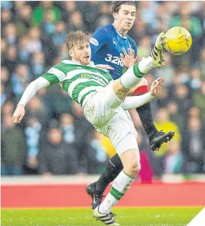  ??  ?? ■
Stuart Armstrong clears under pressure from Josh Windass.