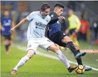  ??  ?? Lazio’s Senad Lulic, left, fights for the ball with Inter Milan’s Joao Cancelo during a Serie A match this season.