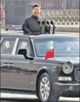  ?? AFP ?? Chinese President Xi Jinping reviews troops from a car during a parade in Beijing.