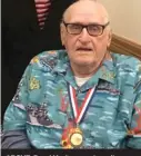  ?? ALEXANDRA OLSEN/ FOR THE SUN- TIMES ?? ABOVE: Pearl Harbor survivor Jim Schlegel wears his Commonweal­th of the Northern Mariana Islands Medallion ofValor on Monday.