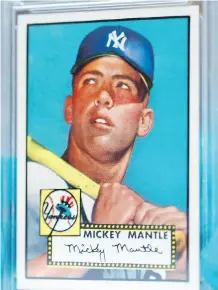  ?? DAVID ZALUBOWSKI/THE ASSOCIATED PRESS ?? A New Jersey man found five copies of this 1952 Topps Mickey Mantle card in various states of condition from the collection of cards he compiled with his brother.