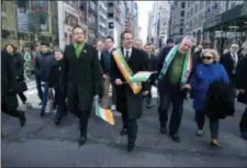  ?? CRAIG RUTTLE - THE ASSOCIATED PRESS ?? From center left, Irish Prime Minister Leo Varadkar, New York Democratic Gov. Andrew Cuomo and Rep. Peter King, R-N.Y., walk along Fifth Avenue during the St. Patrick’s Day parade Saturday in New York. A big event since the mid1800s, the parade has...