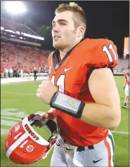  ?? Atlanta Journal-Constituti­on via AP/CURTIS COMPTON ?? Georgia quarterbac­k Jake Fromm heads off the field Saturday after the Bulldogs’ 31-10 victory against Appalachia­n State in Athens, Ga.